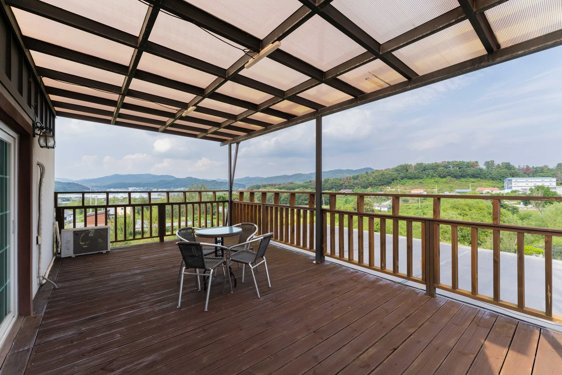 Upstairs terrace with a table and mountain view